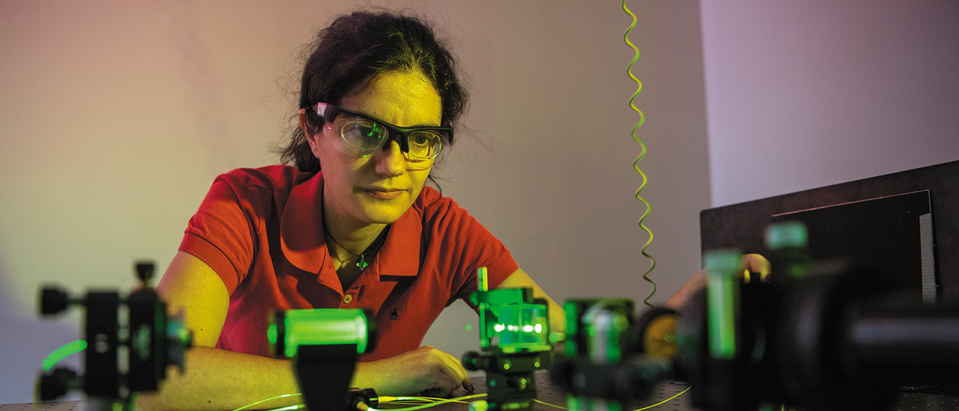 Researcher working with lasers