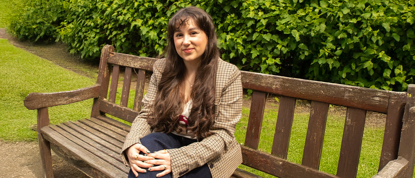 Margaret McDonald sitting on a park bench