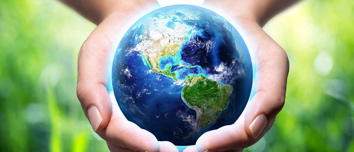 The Earth in being held in a childs hands