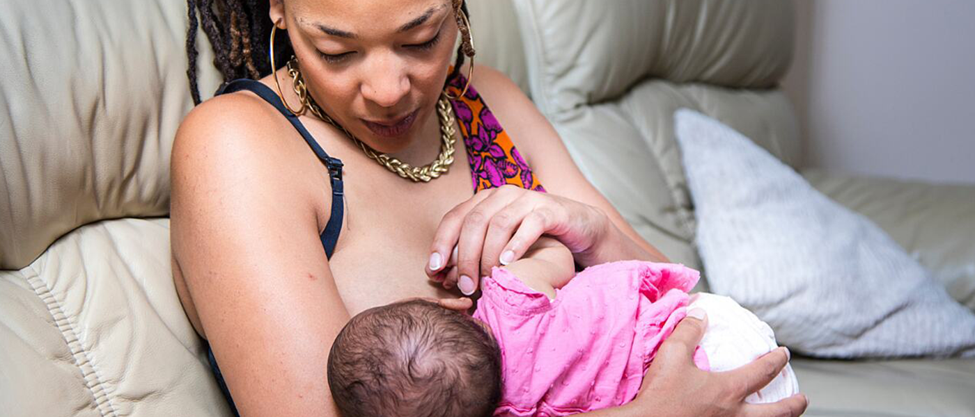 A mother breastfeeding her child