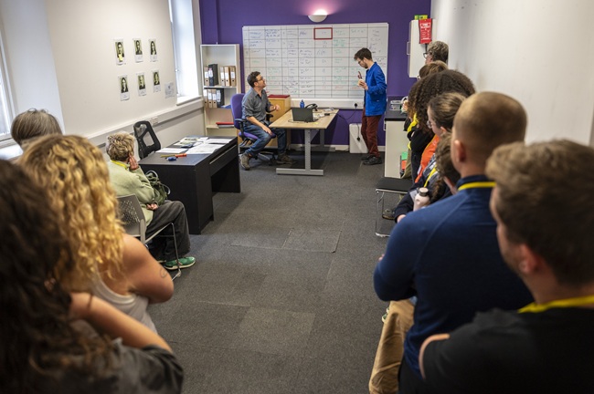 Participants watch a scene where the production team feel the pressure of a demanding shooting schedule in a scene from the Set Ready Safety immersive training programme. Actors: Dave Gerow and Jack Hunter. Credit: Tim Anger Participants watch a scene where the production team feel the pressure of a demanding shooting schedule in a scene from the Set Ready Safety immersive training programme. Actors: Dave Gerow and Jack Hunter. Credit: Tim Anger