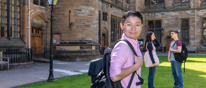 student in cloisters