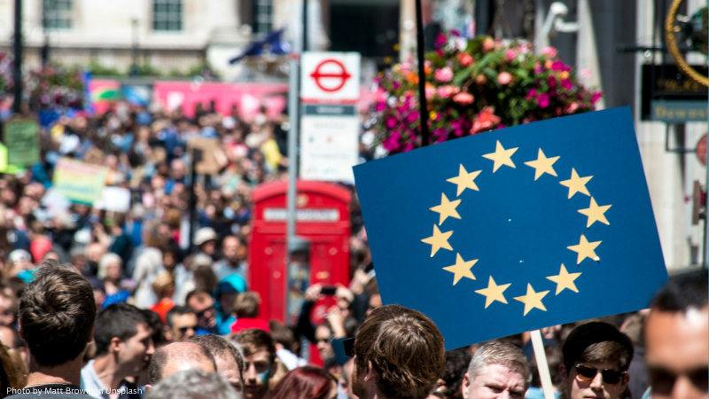 A person carries a EU flag sign in London, UK