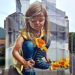 A mural depicting a fair hair girl picking up a daffodil