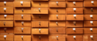 Packed wall of wooden drawers