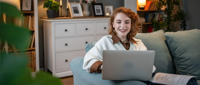 student with laptop at home