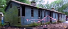 A image of Bobbin Mill hut with tape outside the building
