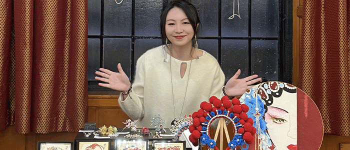 Mengqiu with a display of cultural heritage items