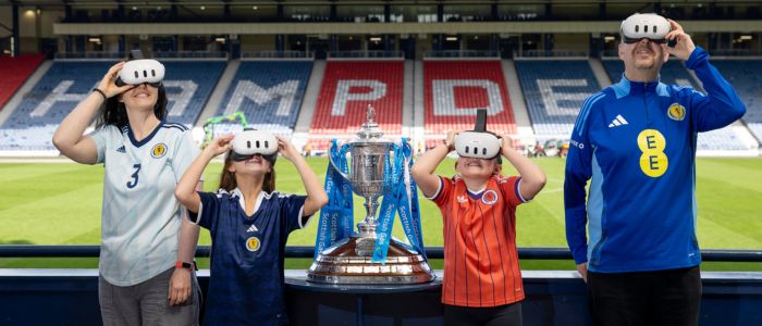 Demi Boyd, curator of Hampden Museum, with Calum Livingstone, Hampden Visitor Services Officer, and pupils from Craighead Primary School, Milton of Campsie, Annabel Gelston, aged 10, (left) and Roma Stevenson, nine.