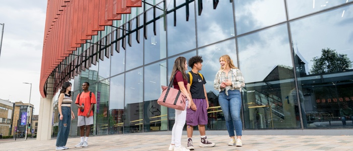 Group of students talking outside JMS