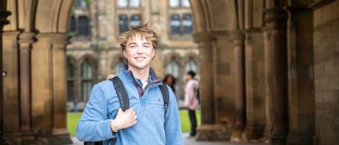 Student in a blue top at the cloisters