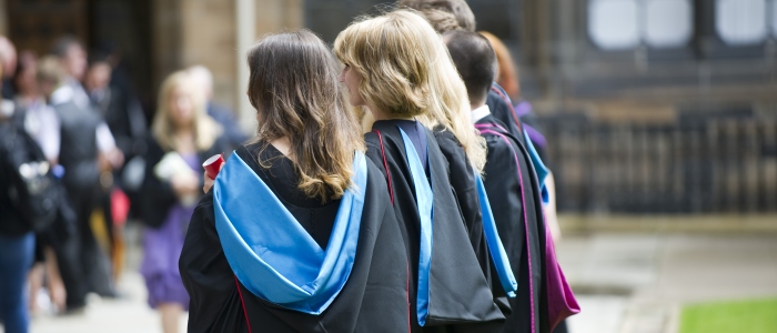 Students having their photo taken in the quadrangle