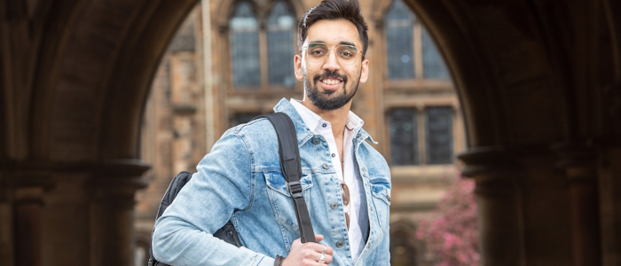 A student on campus at Gilmorehill