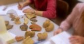 Practical class looking at pottery