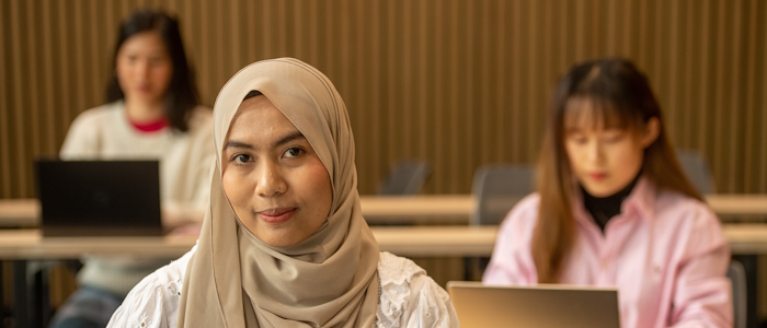 3 female students sitting in a lecture