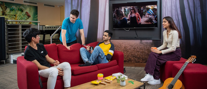 A group of students in the living room of their accommodation