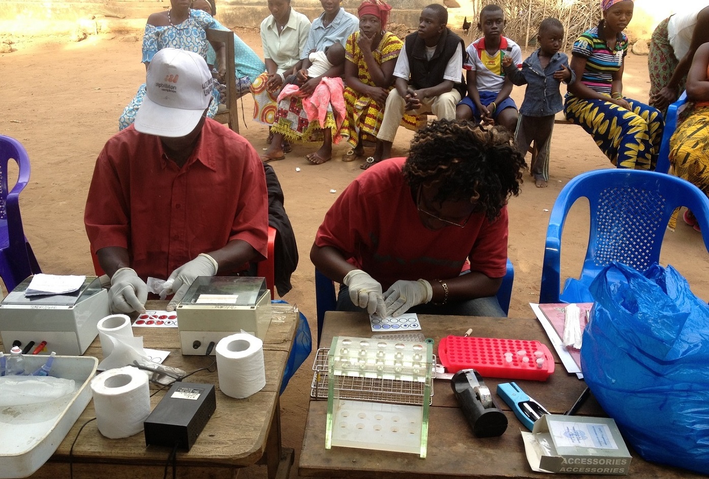 African doctors administering medication for sleeping sickness, Wellcome Trust PhD Programme, University of Glasgow