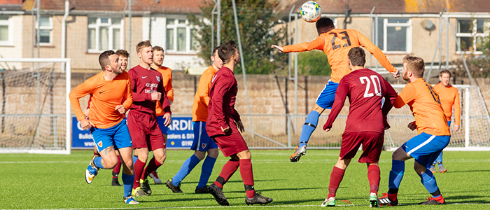 Young people playing football
