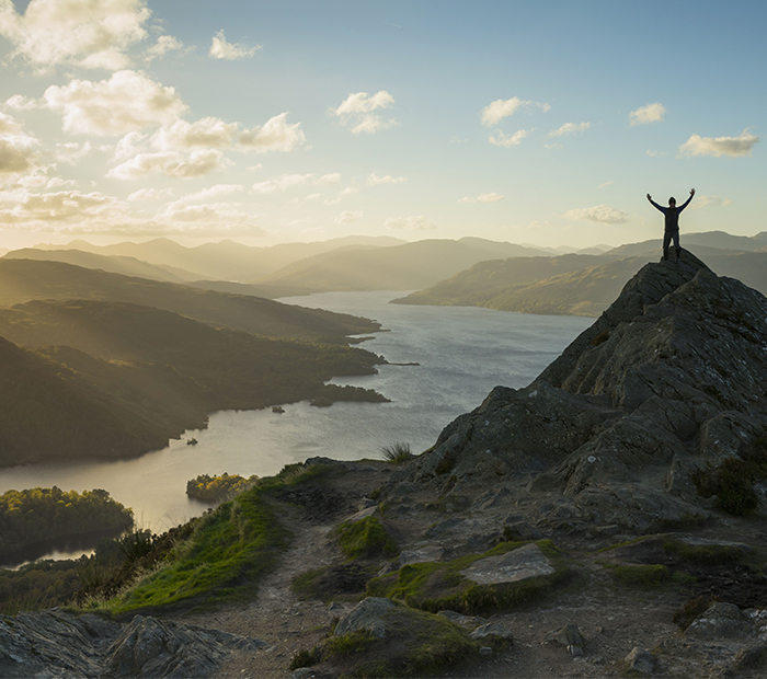 person at the top of Ben A'an on a sunny day