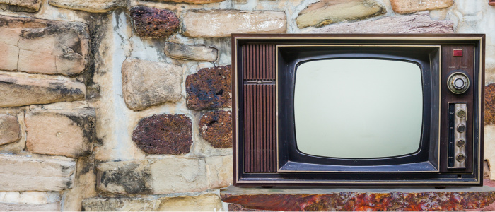 Classic Vintage Retro Style old television with cut out screen,old television on brick background.