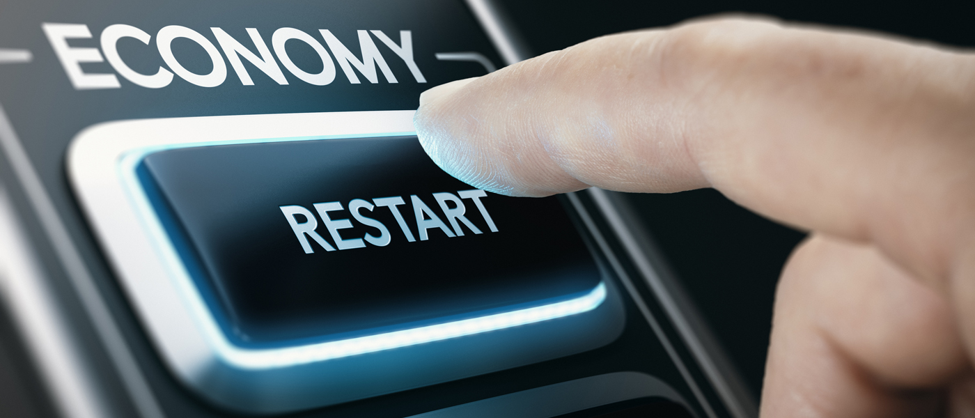 A hand pushes a button which says 'economy restart'