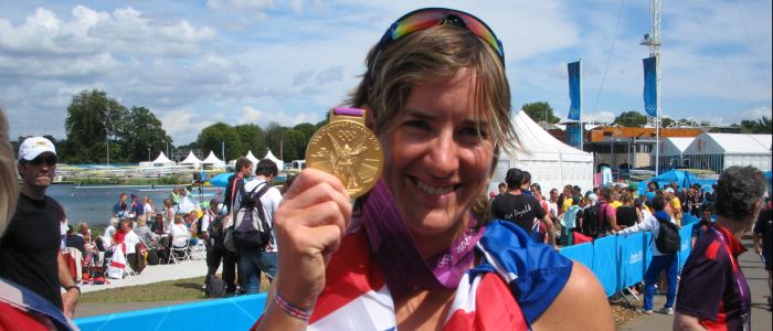 Katherine Grainger holding her Olympic gold medal