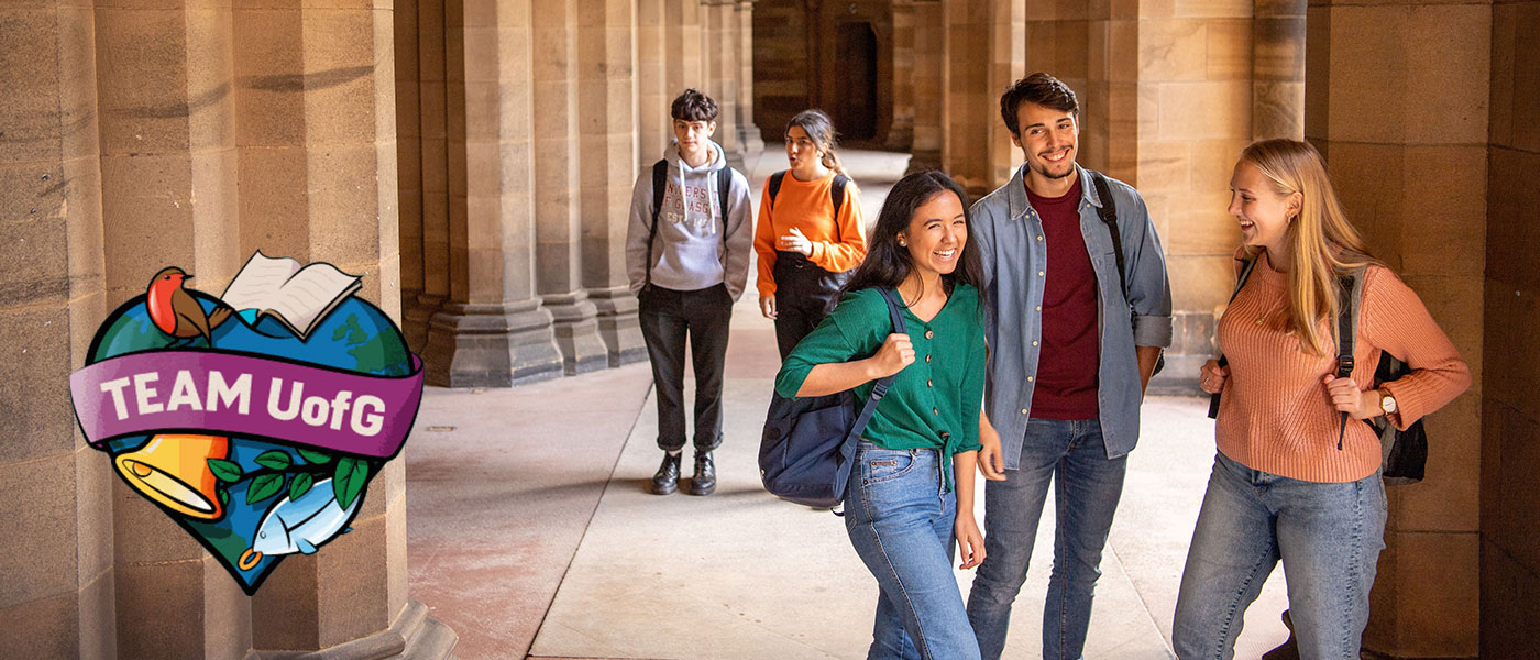Three students chatting in the cloisters