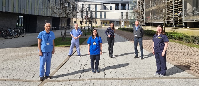 Six doctors and nurses standing outside the QEUH