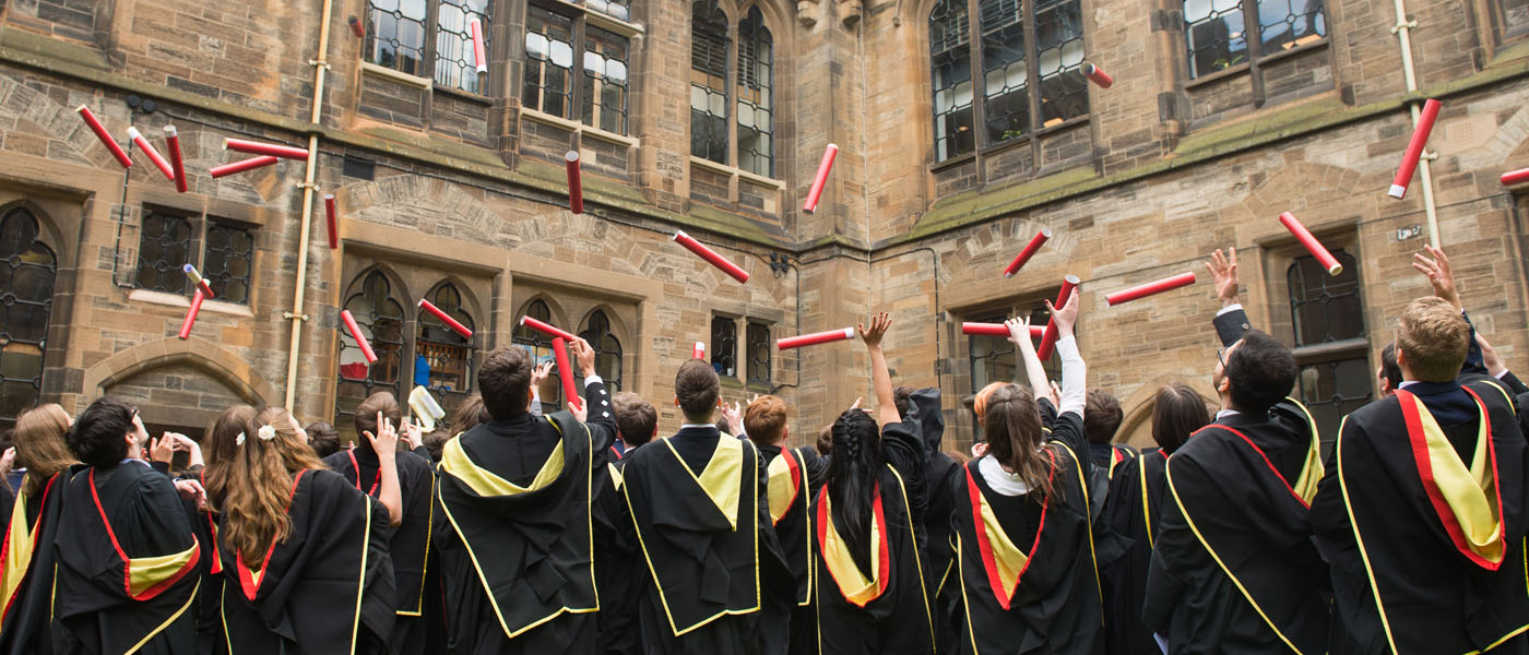 Graduates celebrate in the Cloisters
