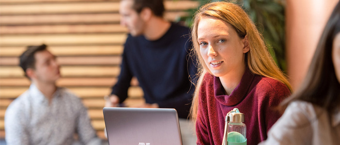 Blonde female student with laptop