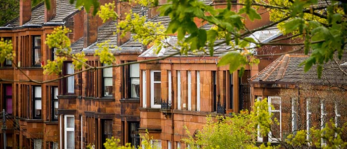 Row of red Glasgow tenements