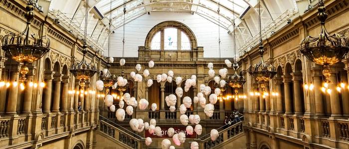 Display of hanging masks in Kelvingrove Art Gallery entrance hall