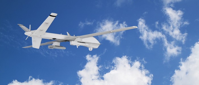 A white military drone flying against a blue sky with white clouds. Source: Sommersby | iStockPhoto https://www.istockphoto.com/photo/military-rc-drone-flies-against-the-backdrop-of-blue-peaceful-sky-with-white-clouds-gm1358942817-432422555
