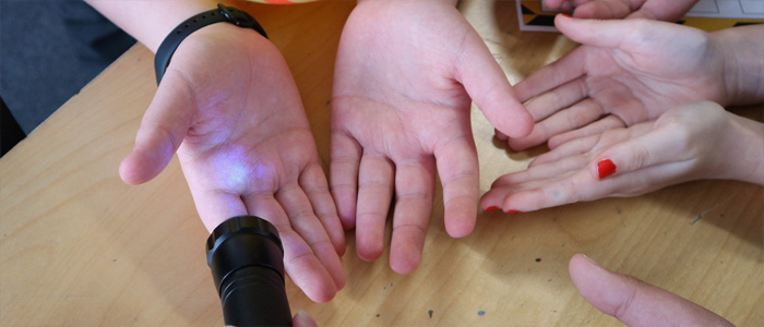 A torch shining on hands