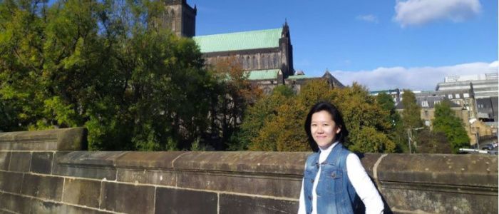 Indonesian exchange student Felicia Iona Roselyn posing in front of a Glasgow church