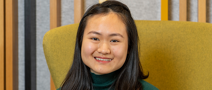 Image of Ashley sitting on a chair