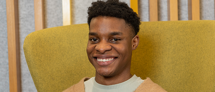 Image of Ryan sitting on a chair